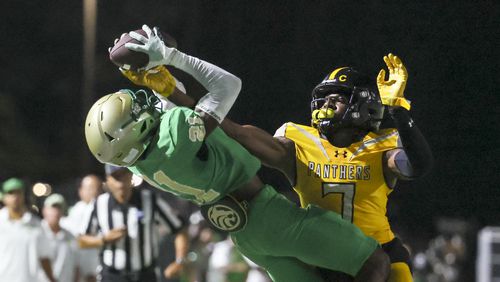 Buford wide receiver Devin Williams (21) makes a catch against St. Frances Academy defensive back Ify Obidegwu (7) for a first down during the second half at Tom Riden Stadium, Friday, August 18, 2023, in Buford, Ga. Buford would score a field goal on the drive. Buford won 18-0. (Jason Getz / Jason.Getz@ajc.com)