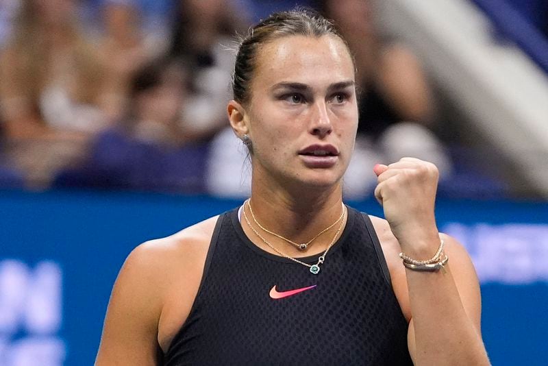 Aryna Sabalenka, of Belarus, reacts after scoring a point against Emma Navarro, of the United States, during the women's singles semifinals of the U.S. Open tennis championships, Thursday, Sept. 5, 2024, in New York. (AP Photo/Frank Franklin II)