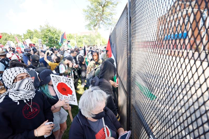 Protesters marched to Washington Boulevard toward a fence outside the Democratic National Convention after a rally at Union Park on Monday.