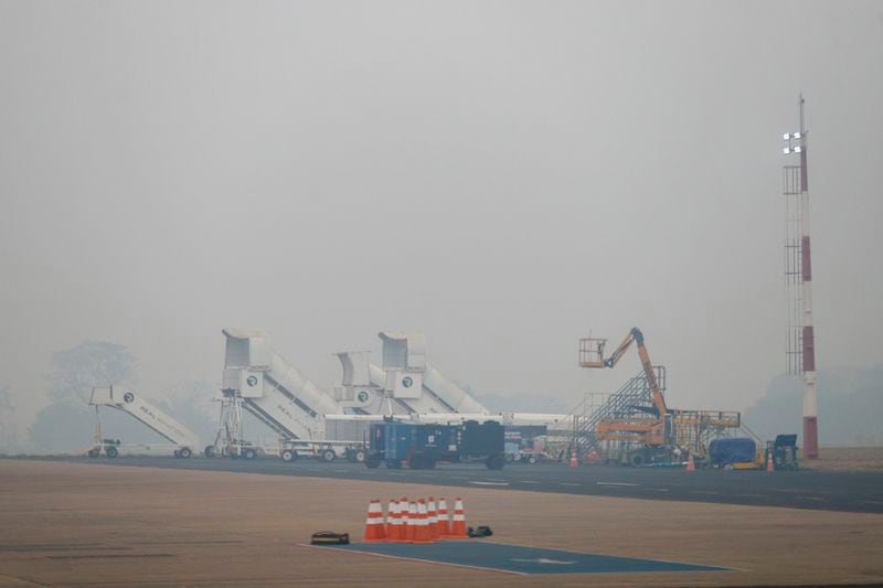 Smoke from wildfires fills the air at Dr. Leite Lopes State Airport in Ribeirao Preto, Sao Paulo state, Brazil, Sunday, Aug. 25, 2024. (AP Photo/Marcos Limonti)