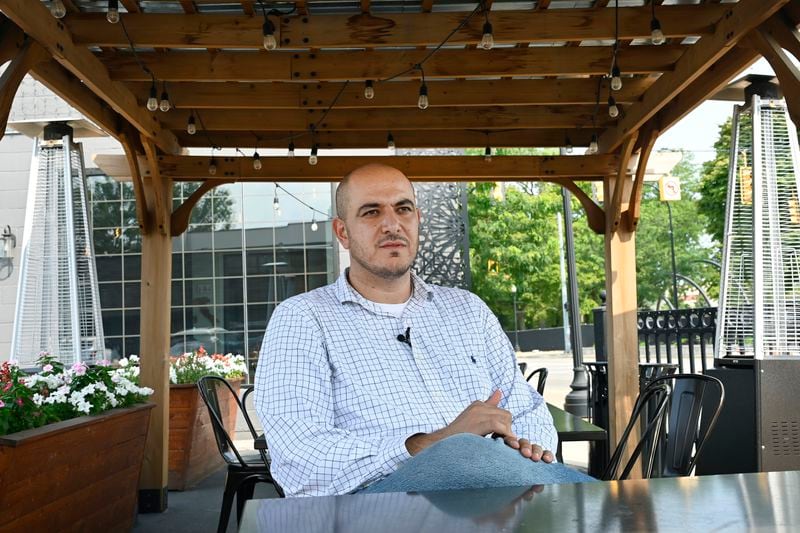 Uncommitted delegate to the Democratic National Convention Abbas Alawieh answers questions during an interview Wednesday, Aug. 14, 2024, in Dearborn, Mich. (AP Photo/Jose Juarez)