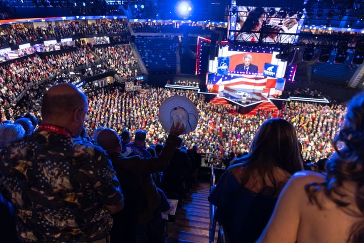 Attendees pray with Franklin Graham, president and CEO of the Billy Graham Evangelistic Association, at Fiserv Form in Milwaukee on Thursday, July 18, 2024, the fourth day of the Republican National Convention (Arvin Temkar / AJC)