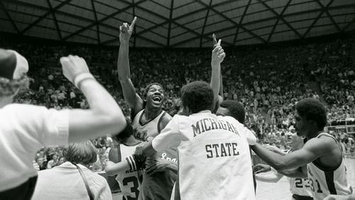 Michigan State's Earvin (Magic) Johnson raises his finger to indicate the Spartans are number one after defeating Larry Bird's Indiana State team 75-64 to win the NCAA Championship March 26, 1979, in Salt Lake City.