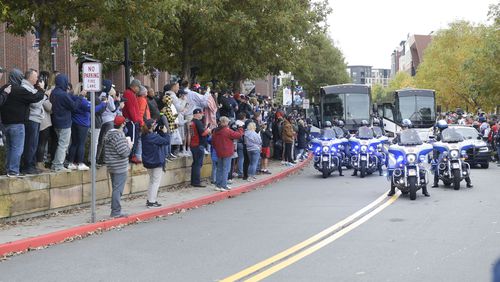 Fans line the streets at the Battery to send off the Atlanta Braves as they begin trip to downtown Atlanta where festivities will being Friday, Nov. 5, 2021. (Daniel Varnado/ For the Atlanta Journal-Constitution)