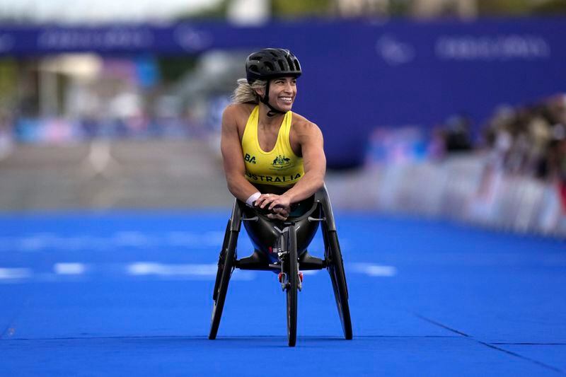 Australian athlete Madison de Rosario reacts as she wins the silver medal in the women's marathon T54 at the 2024 Paralympic Games, Sunday, Sept. 8, 2024, in Paris, France. (AP Photo/Thibault Camus)