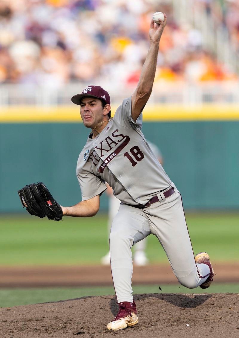 Texas A&M starting pitcher Ryan Prager throws to a Tennessee batter during the first inning in Game 1 of the NCAA College World Series baseball finals in Omaha, Neb., Saturday, June 22, 2024. (AP Photo/Rebecca S. Gratz)