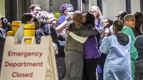 Staff gathers outside Wellstar Atlanta Medical Center on Friday, Oct. 14, 2022, after the hospital closes is ER. The hospital is scheduled to close completely on. Nov.1, 2022. (John Spink / John.Spink@ajc.com)