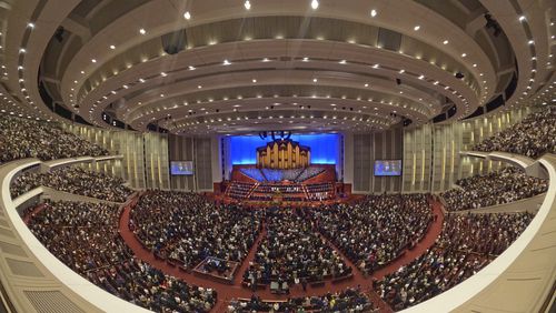 FILE - This image made with a fisheye lens shows people attending the twice-annual conference of the Church of Jesus Christ of Latter-day Saints, on April 7, 2024, in Salt Lake City. (AP Photo/Rick Bowmer, File)