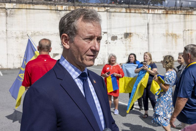 U.S. Rep. Matt Cartwright, PA-08, talks to Ukraine supporters before President of Ukraine Volodymyr Zelenskyy's motorcade arrives at the Scranton Army Ammunition Plant in Scranton on Sunday, Sept. 22, 2024. The plant manufactures artillery ammunition which is used in Ukraine. (AP Photo/Laurence Kesterson)