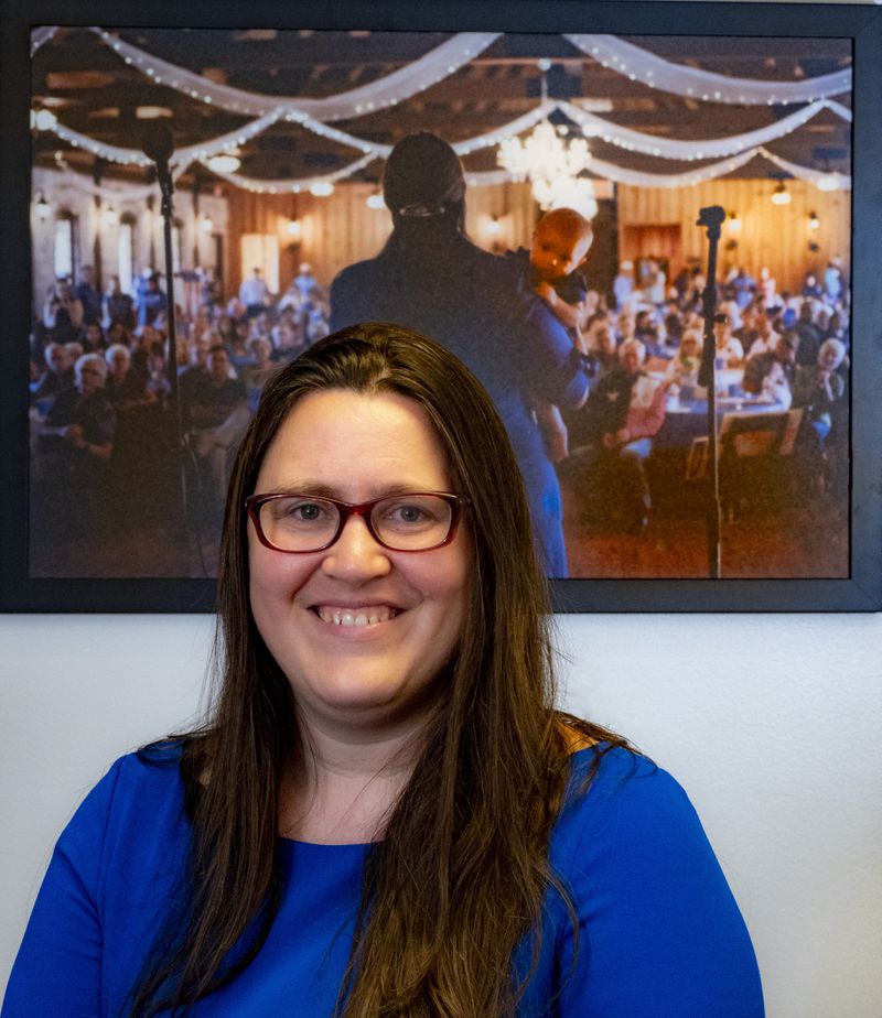 Texas House of Representatives member Erin Zweiner poses for a photo in her office in front of a photograph with her daughter, Lark, taken at a previous event, Friday, Sept. 6, 2024, in Austin, Texas. (AP Photo/Michael Thomas)