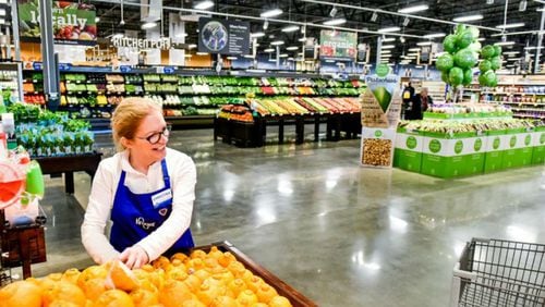 In this image dated June 2020, a Kroger employee restocks produce. Locally, a Kroger store in southwest Atlanta was forced to close after thieves stole critical electrical wiring, leaving the store without power. The store closure also left some individuals in surrounding neighborhoods with limited shopping options for fresh, healthy foods. (Nick Graham/daytondailynews.com).