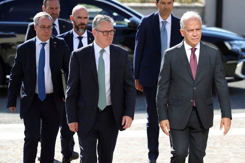 British Prime Minister Keir Starmer, center, and Italian Minister of the Interior Matteo Piantedosi arrive to visit the National Coordination Center, in Rome, Sept. 16, 2024. (Phil Noble/Pool Photo via AP)