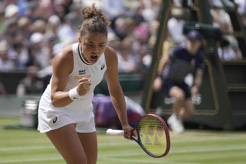 Jasmine Paolini of Italy celebrates winning a point against Donna Vekic of Croatia during their semifinal match at the Wimbledon tennis championships in London, Thursday, July 11, 2024. (AP Photo/Mosa'ab Elshamy)