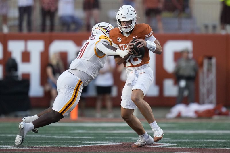 Texas quarterback Arch Manning (16) is pressured by Louisiana-Monroe defensive lineman Dylan Howell (41) during the first half of an NCAA college football game in Austin, Texas, Saturday, Sept. 21, 2024. (AP Photo/Eric Gay)