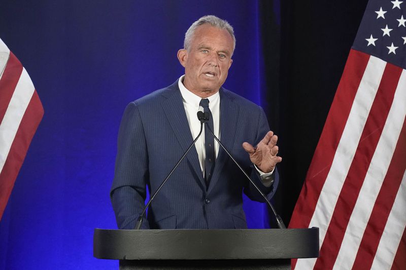 Independent presidential candidate Robert F. Kennedy Jr. announces he is suspending his presidential campaign at a news conference Friday, Aug 23, 2024, in Phoenix. (AP Photo/Darryl Webb)