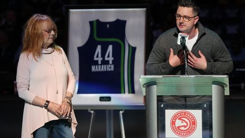 Pete Maravich's wife Jackie looks on while their son Josh speaks as Pete's No. 44 Hawks jersey is retired in a halftime ceremony of a Hawks game at Philips Arena on Friday, March 3, 2017, in Atlanta.   Curtis Compton/ccompton@ajc.com