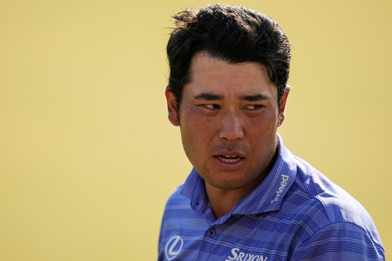 Hideki Matsuyama, of Japan, walks off tghe 18th green during the first round of the Tour Championship golf tournament, Thursday, Aug. 29, 2024, in Atlanta. (AP Photo/Mike Stewart)