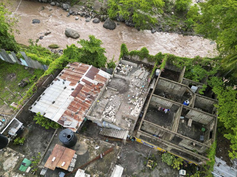 An aerial view of a home damaged by Hurricane Beryl in Kingston, Jamaica, Thursday, July 4, 2024. (AP Photo/Leo Hudson)