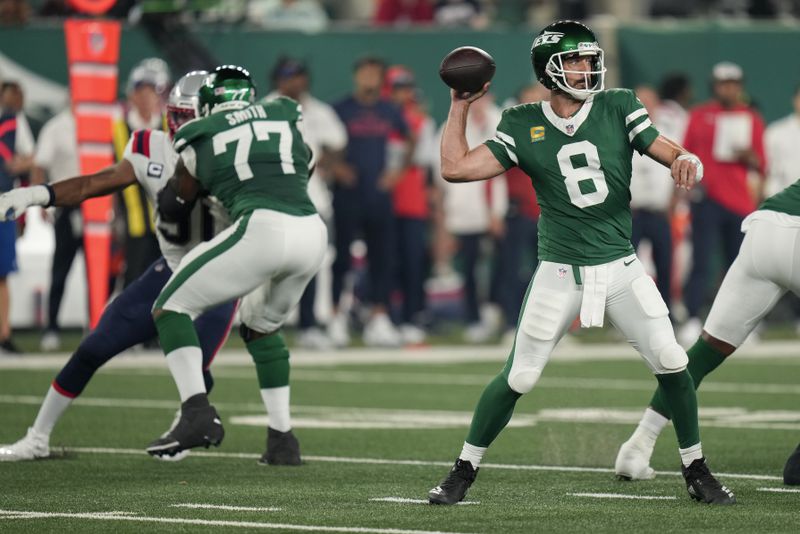 New York Jets quarterback Aaron Rodgers (8) passes against the New England Patriots during the first quarter of an NFL football game, Thursday, Sept. 19, 2024, in East Rutherford, N.J. (AP Photo/Seth Wenig)