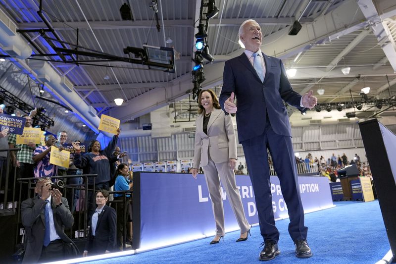 Democratic presidential nominee Vice President Kamala Harris, left, and President Joe Biden depart after speaking about the administration's efforts to lower prescription drug costs during an event at Prince George's Community College in Largo, Md., Thursday, Aug. 15, 2024. (AP Photo/Susan Walsh)