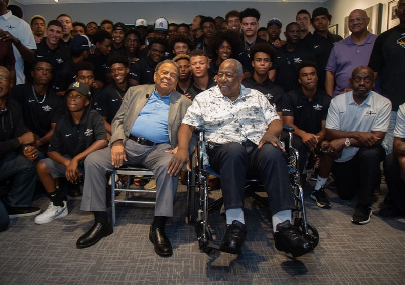 Andrew Young (L) and Hank Aaron pose for photos with the participants at the end of the Hank Aaron Invitational at  SunTrust Park in Atlanta August 2, 2019.  STEVE SCHAEFER / SPECIAL TO THE AJC