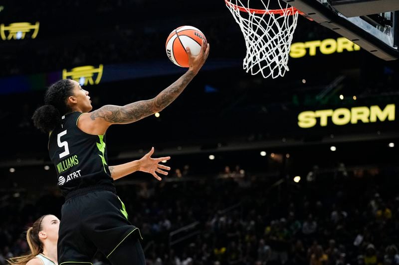 Seattle Storm forward Gabby Williams goes up to the basket against New York Liberty guard Sabrina Ionescu during the first half of a WNBA basketball game Friday, Aug. 30, 2024, in Seattle. (AP Photo/Lindsey Wasson)