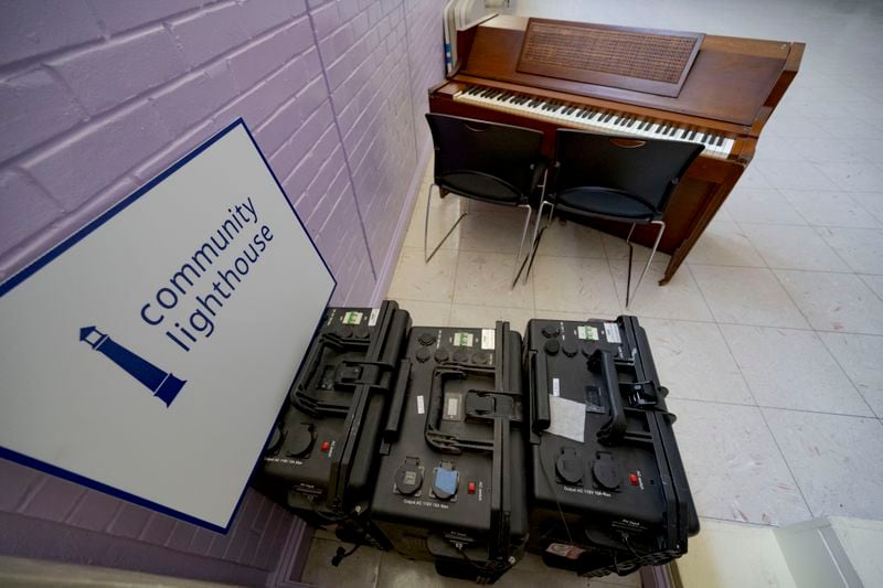 A sign for the Community Lighthouse initiative is displayed at First Grace United Methodist Church that uses microgrids, a small-scale power system that can operate and provide electricity amid hurricanes, in New Orleans, Wednesday, Sept. 25, 2024. (AP Photo/Matthew Hinton)