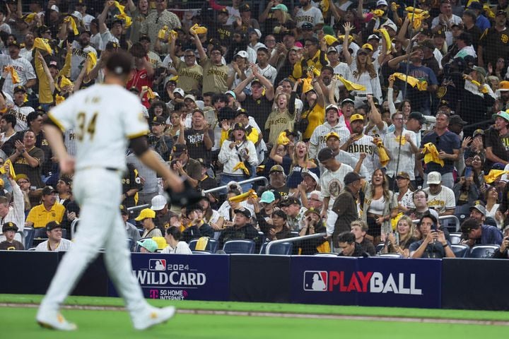 San Diego Padres pitcher Michael King (34) is applauded after recording his tenth strikeout against the Atlanta Braves during the sixth inning of National League Division Series Wild Card Game One at Petco Park in San Diego on Tuesday, Oct. 1, 2024.   (Jason Getz / Jason.Getz@ajc.com)