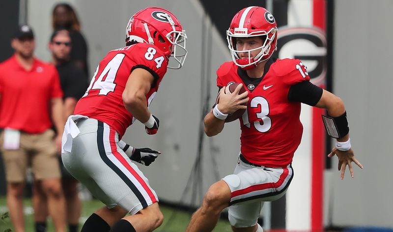 Georgia QB Stetson Bennett scrambles for yardage in the first half of Saturday's game against Arkansas. (Curtis Compton/ccompton@ajc.com)