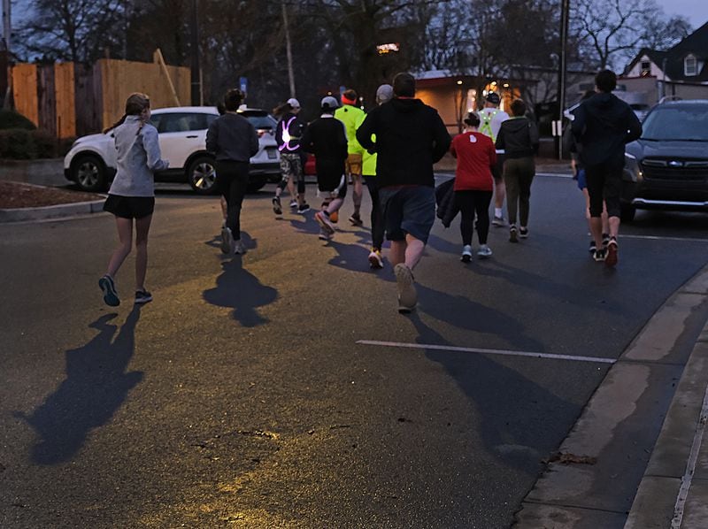 The Athens Road Runners take off from Athentic Brewing Company for a short evening run in Athens on Wednesday, Feb. 28, 2024. (Nell Carroll for The Atlanta Journal-Constitution)