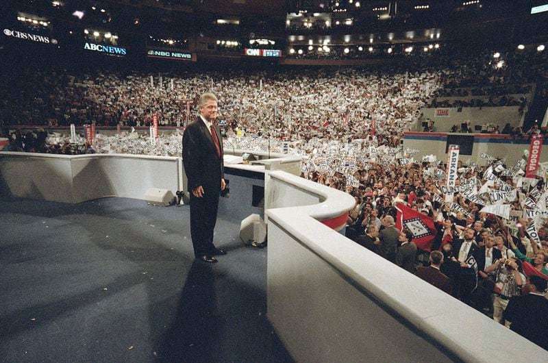 FILE - Democratic presidential nominee Bill Clinton faces a cheering audience after taking the podium to deliver his acceptance speech as his party's presidential nominee at the Democratic National Convention in New York, July 16, 1992. (AP Photo/Stephan Savoia, file)