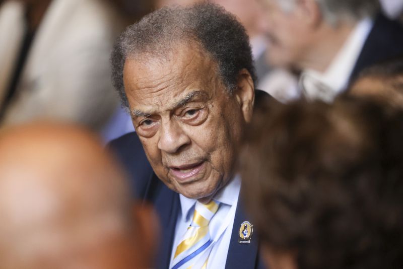 Ambassador Andrew Young talks with guests before the start of the event to unveil the Hank Aaron statue by the grand staircase at the National Baseball Hall of Fame, Thursday, May 23, 2024, in Cooperstown, NY. (Jason Getz / AJC)
