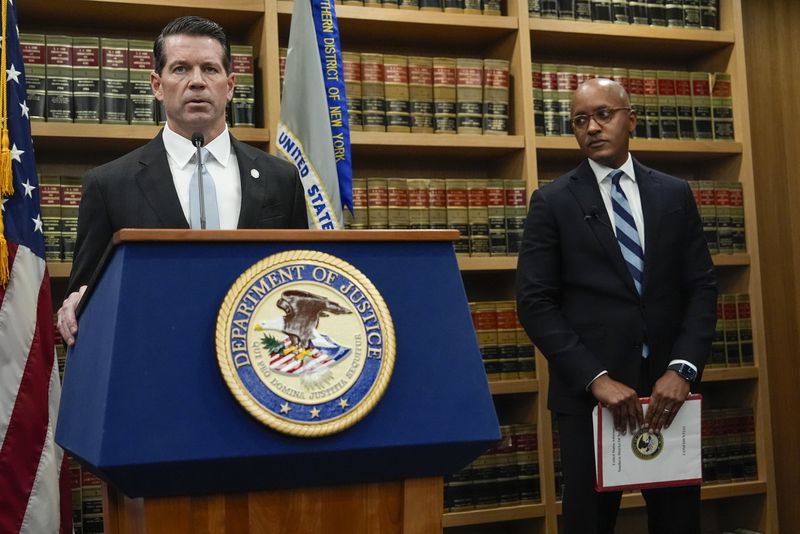 James Dennehy, FBI New York Assistant Director in Charge, left, speaks at a news conference detailing an indictment against New York City Mayor Eric Adams as U.S. Attorney Damian Williams looks on, Thursday, Sept. 26, 2024, in New York. (AP Photo/Julia Demaree Nikhinson)