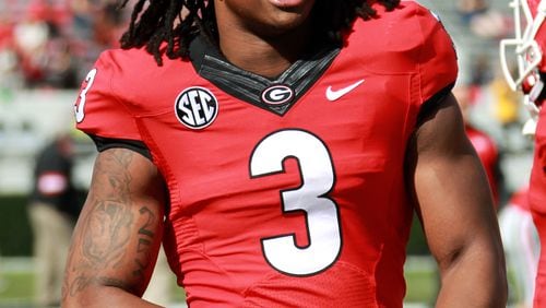 University of Georgia tailback Todd Gurley talks with teammates before their game against Appalachian State at Sanford Stadium. Georgia defeated Appalachian State 45-6.