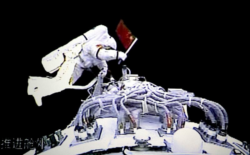 FILE - In this image from video provided by the Beijing Space Command and Control Center and the Xinhua News Agency on Sept. 27, 2008, Chinese astronaut Zhai Zhigang walks outside the orbit module of the Shenzhou-7 spacecraft for a spacewalk after docking with the Chinese station Tiangong 1. (Beijing Space Command and Control Center, Xinhua via AP, File)