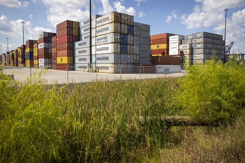 Stacked containers line the Bayport Container Terminal during the first day of a dockworkers strike on Tuesday, Oct. 1, 2024, in Houston. (AP Photo/Annie Mulligan)