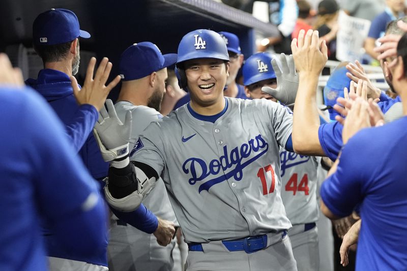 Los Angeles Dodgers' Shohei Ohtani (17) celebrates after hitting a home run during the sixth inning of a baseball game against the Miami Marlins, Thursday, Sept. 19, 2024, in Miami. (AP Photo/Marta Lavandier)