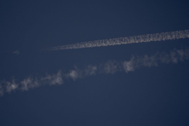 An armed Israeli fighter jet flies over Haifa, northern Israel, Wednesday, Sept. 25, 2024. (AP Photo/Ariel Schalit)