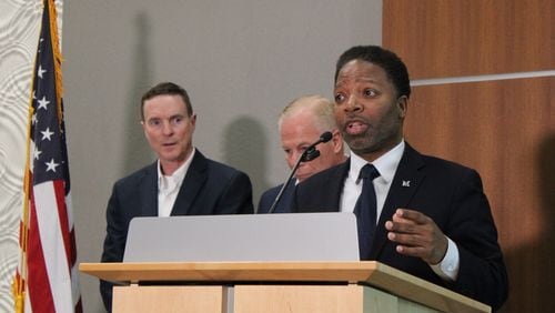 Mableton Mayor Michael Owens (right) speaks at a press conference alongside Cobb County Police Chief Stuart VanHoozer (left) and Cobb County Public Safety Director Mike Register after a public safety meeting about safety in the Six Flags area on Tuesday, March 12, 2024. (Taylor Croft/taylor.croft@ajc.com)