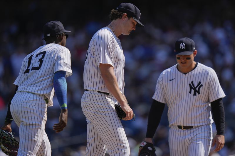 New York Yankees pitcher Gerrit Cole reacts after Boston Red Sox's Masataka Yoshida, of Japan, hit a two-run single during the fifth inning of a baseball game Saturday, Sept. 14, 2024, in New York. (AP Photo/Frank Franklin II)