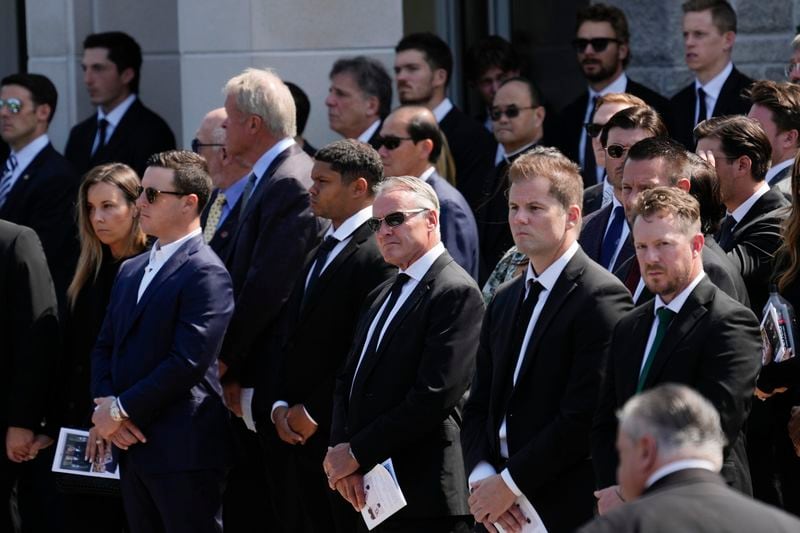 Mourners watch as the remains of Columbus Blue Jackets hockey player John Gaudreau and his brother Matthew Gaudreau depart after a funeral at St. Mary Magdalen Catholic Church in Media, Pa., Monday, Sept. 9, 2024. (AP Photo/Matt Rourke)