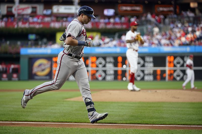 Atlanta Braves' Austin Riley, left, rounds the bases after hitting a two-run home run against Philadelphia Phillies pitcher Cristopher Sanchez during the first inning of a baseball game, Wednesday, Sept. 13, 2023, in Philadelphia. (AP Photo/Matt Slocum)