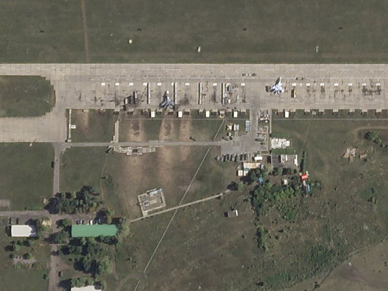 This satellite photo from Planet Labs PBC shows damaged fighter jets at the Borisoglebsk Air Base in Russia after an attack by Ukrainian drones on Wednesday, Aug. 14, 2024. (Planet Labs PBC via AP)