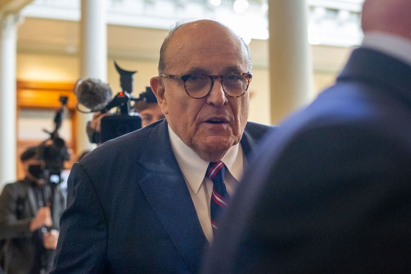 Rudy Giuliani walks to a senate hearing at the Georgia State Capitol in Atlanta on Thursday, December 3, 2020. The Georgia Senate Committee on Judiciary has formed a special subcommittee to take testimony of elections improprieties and evaluate the election process. (Rebecca Wright for the Atlanta Journal-Constitution)