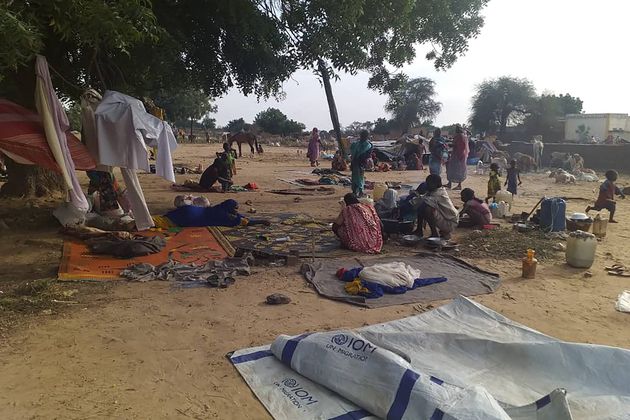 FILE - Residents displaced from a surge of violent attacks squat on blankets and in hastily made tents in the village of Masteri in west Darfur, Sudan, on July 30, 2020. (Mustafa Younes via AP, File)