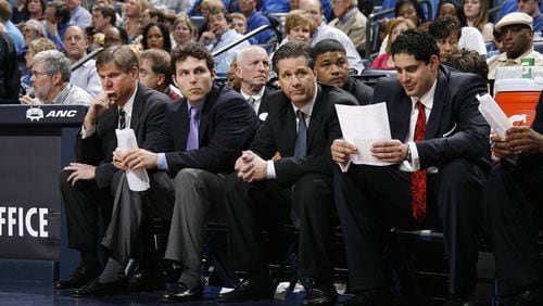 In a March 2009 photo, then-Memphis coach John Calipari sits next to his then-assistant Josh Pastner during a game against Tulane. In a month's time from the photo, Calipari was coach at Kentucky and Pastner was his replacement at Memphis. (Joe Murphy)