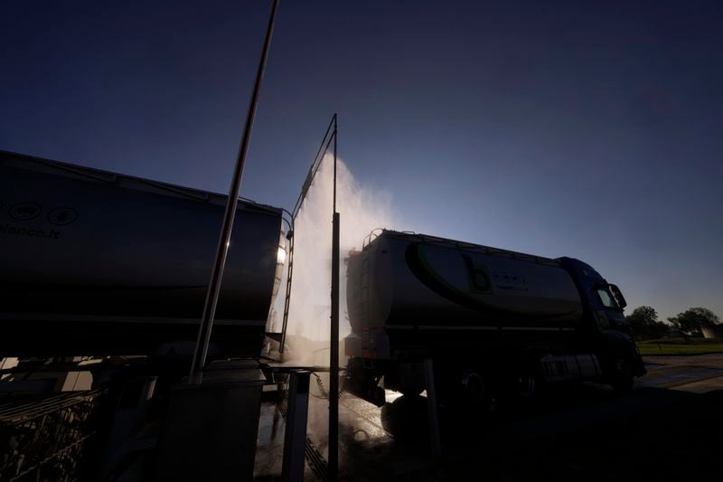 A truck is disinfected before entering the Piggly farm in Pegognaga, near Mantova, northern Italy, Wednesday, Sept. 25, 2024. (AP Photo/Luca Bruno)