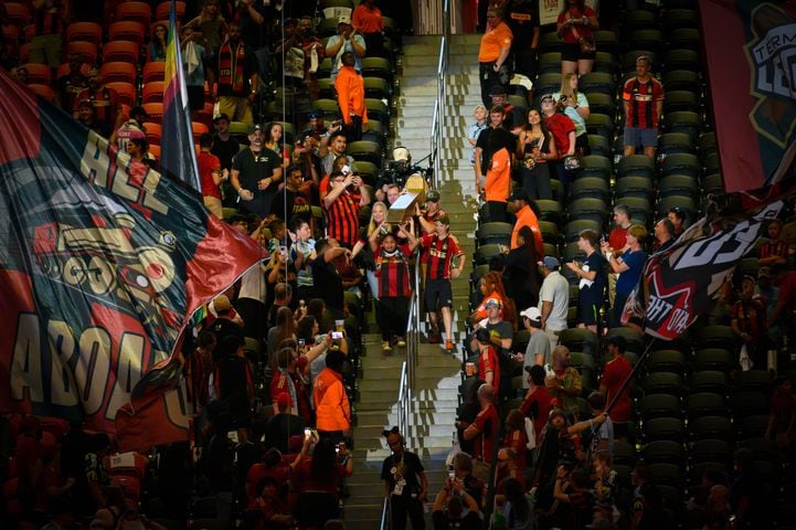 The golden spike is brought down to the field during the Atlanta United game against Columbus Crew at Mercedes Benz Stadium in Atlanta, GA on July 20, 2024. (Jamie Spaar for the Atlanta Journal Constitution)