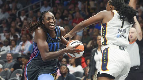 Atlanta Dream center Tina Charles drives to the basket in a June game. (Jason Getz / AJC)