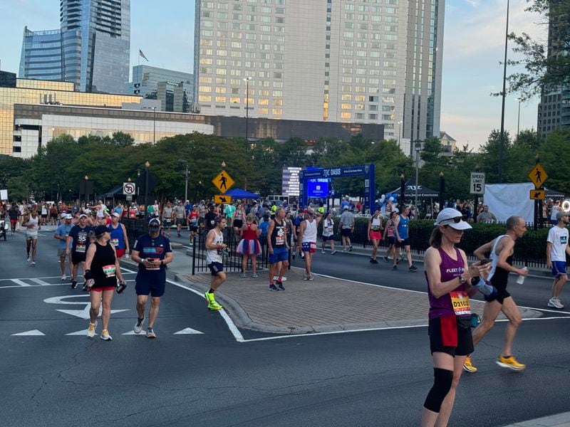 Runners are gathering as the official 7 a.m. start approaches for The Atlanta Journal-Constitution Peachtree Road Race on Thursday, July 4, 2024. (Photo: Caleb Groves/AJC)